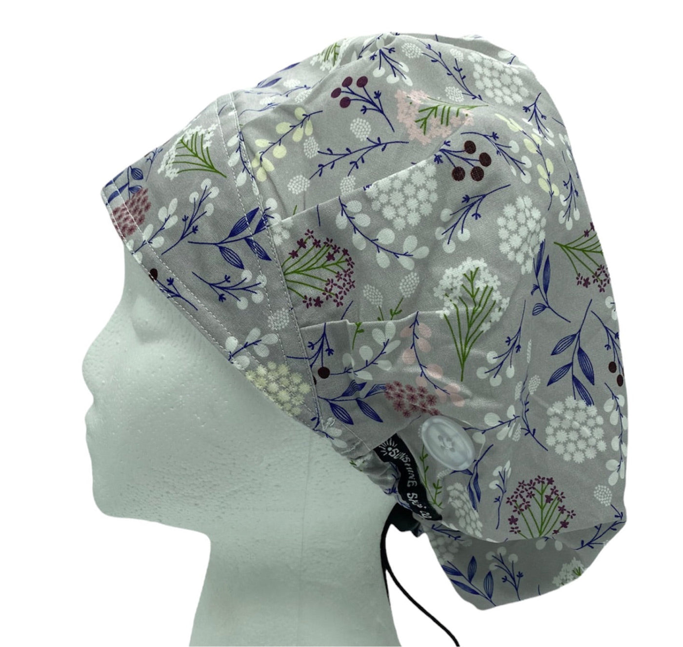 Gray dandelion bouffant surgical scrub caps with buttons and sweatband for women with long hair by sunshine shops co